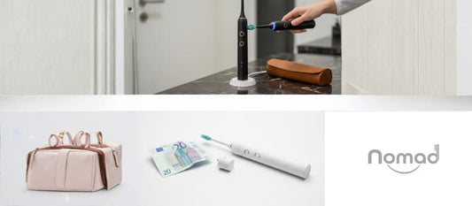 une brosse à dents électrique noire élégante sur un plan de travail en marbre